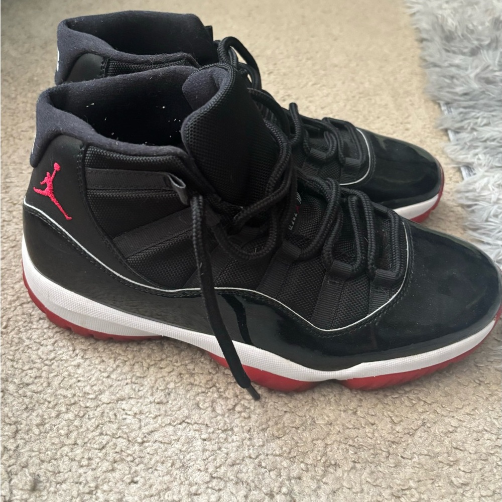 Air Jordan 11 Retro Men's Black and Red High-Top Sneakers